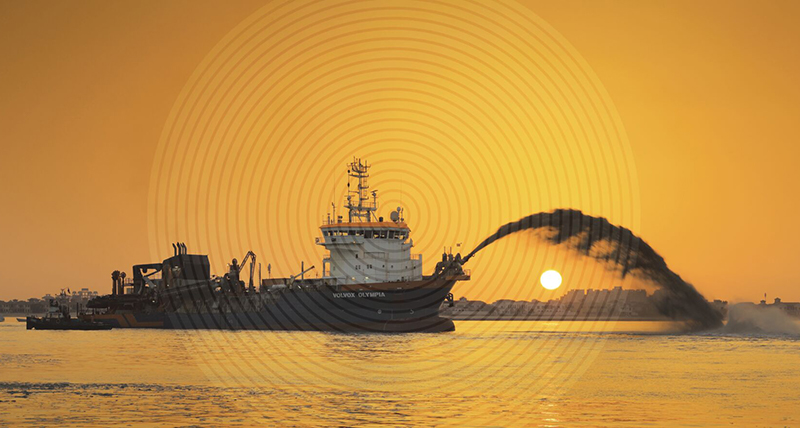 Dredging vessel working in the ocean at sunset with a white circle overlay on top of the vessel.  